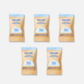 Four brown packets labeled Blueland Dishwasher Detergent Sample Pack (5 Tablets) are shown. In front is a dry white tablet with a blue center to make dishes sparkling clean. The fragrance-free product weighs 0.67 g per packet.